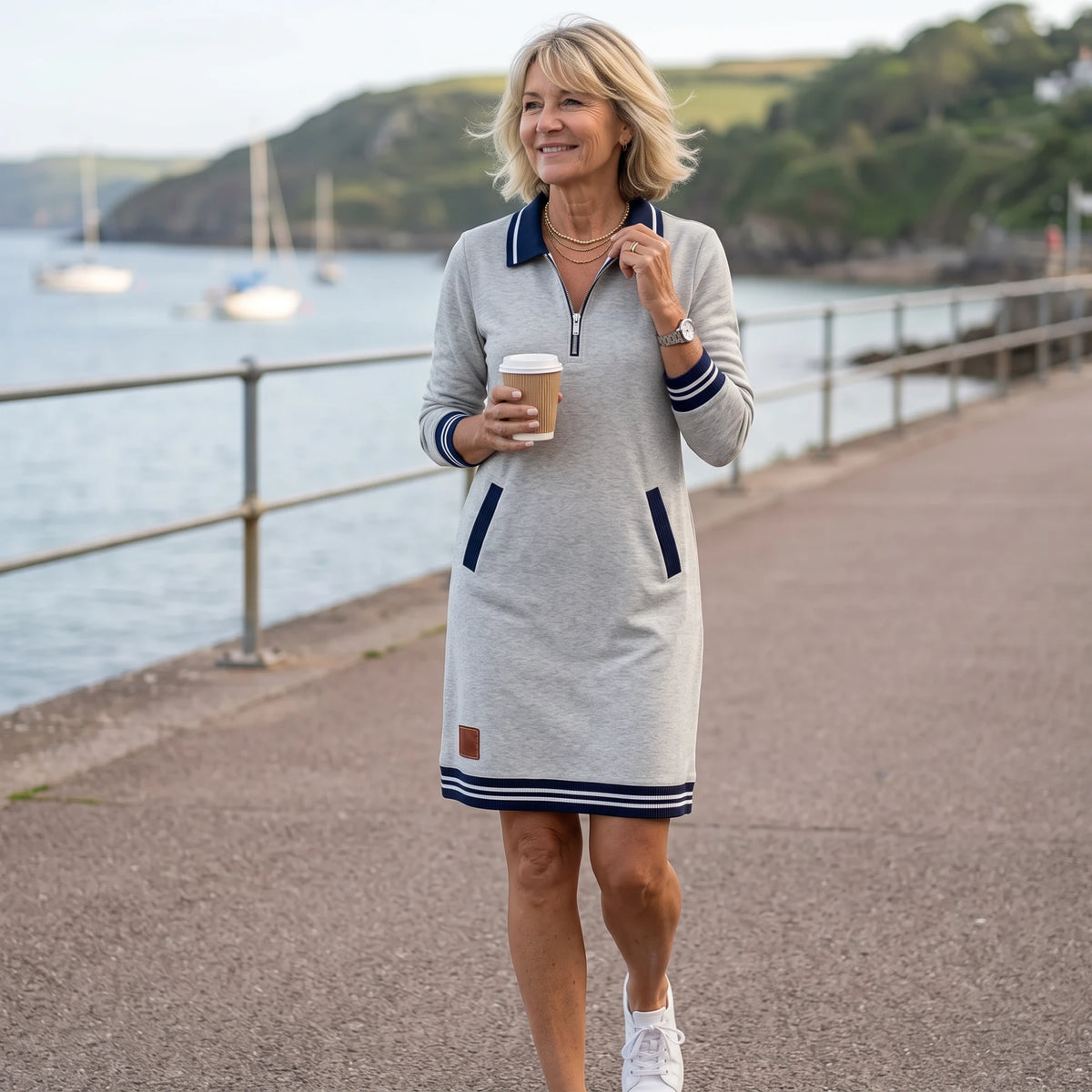The Dorellia in Grey — crisp navy-and-white trims, ready for a walk along the water.