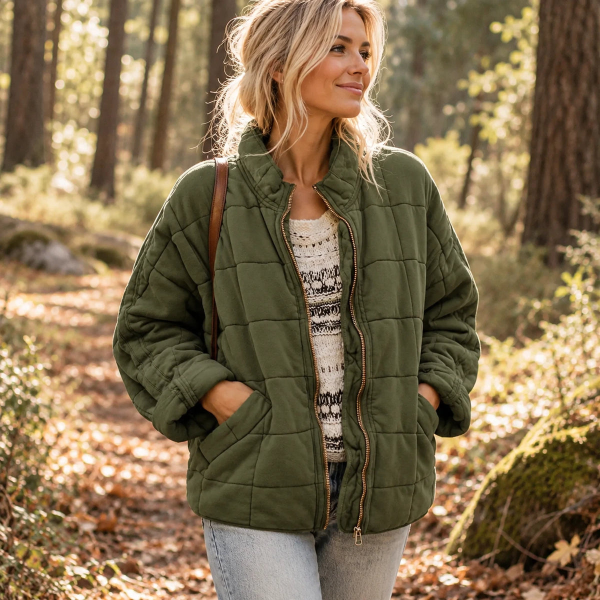 The quilted jacket in Green — soft square quilting and a full front zip.