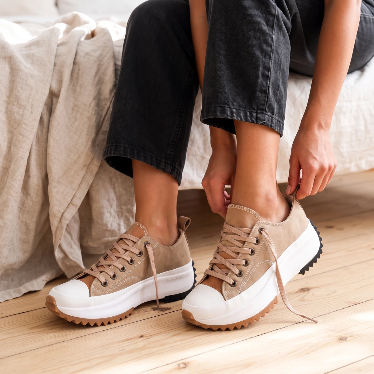 The Lunastar in Tan — a cushioned platform with a clean white toe cap.